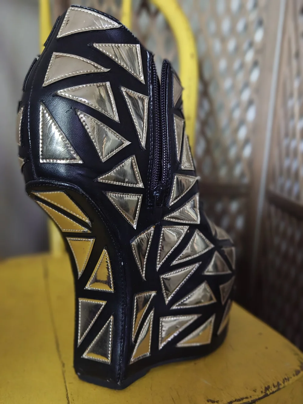 Prestiged Women's Black Ankle Wedge Booties with Gold Geometric Accents
